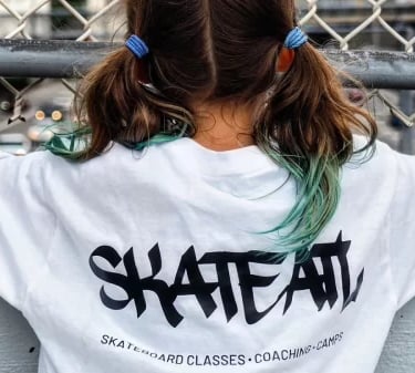 a girl wearing skateatl t-shirt