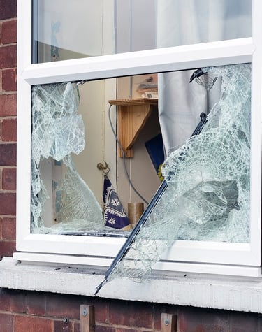 damaged glass in window due to break-in