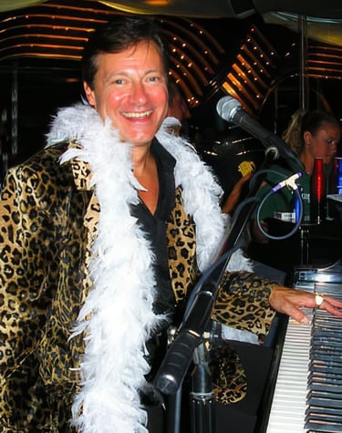 'HencetheOutfit' cruise ship Piano-bar performance in a leopard jacket with white boa