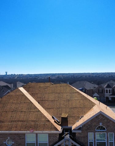 roof replacement photo showing roof stripped down to the bare decking to allow for inspection 