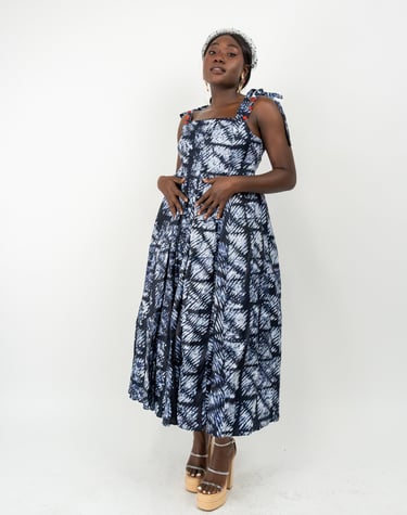 a woman in a blue dress and heels