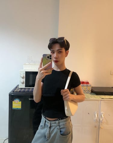 Massage therapist taking selfie at his kitchen in Pattaya