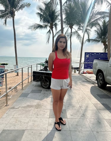 Experienced home massage therapist standing by the beach in Pattaya 