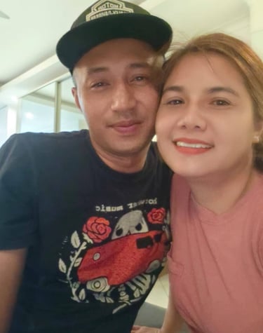 couple looking at camera cheek to cheek