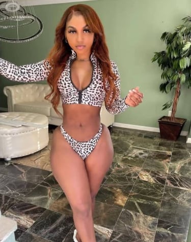 Experienced home massage therapist in Pattaya with a friendly and welcoming appearance, photographed in a night market