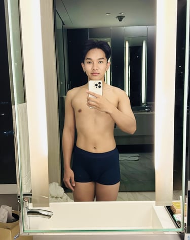 a man taking a photo while looking into a mirror