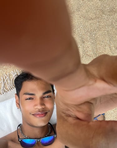 Experienced home massage therapist in Pattaya with a friendly and welcoming appearance, photographed in a night market