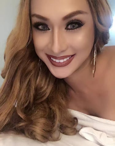 Portrait image of a smiling ladyboy therapist