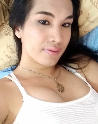 Ladyboy massage therapist with white top