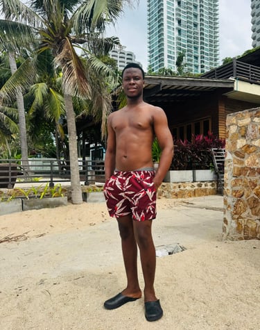 man wearing red and white shorts with his hands in his pockets