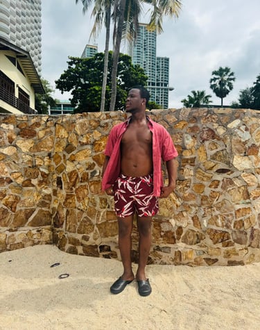 man wearing red and white shorts and red short sleeve shirt with buttons open