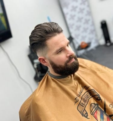 Man with brunette hair, skin fade and beard trim at Yau Barber Studio in Orsett, Essex