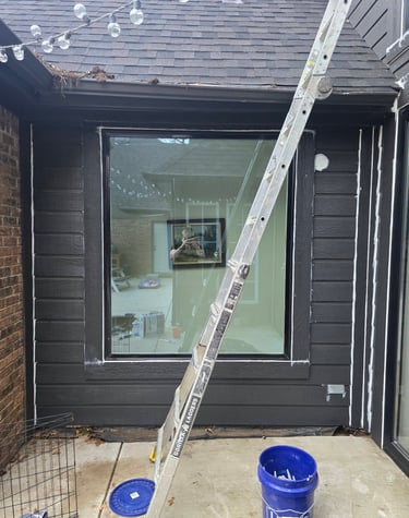 Framed window that is is being sealed from rain leaks