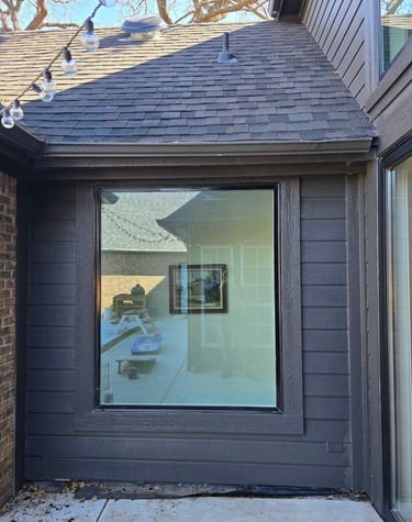 Framed window that has been sealed and painted