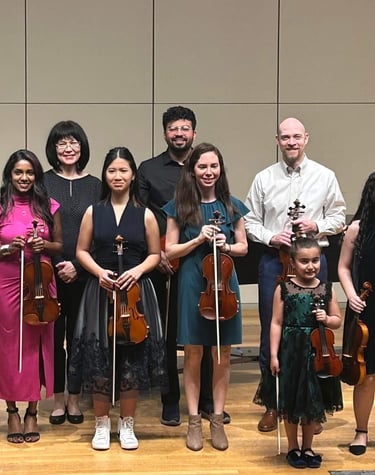 Group of violin students with their teacher