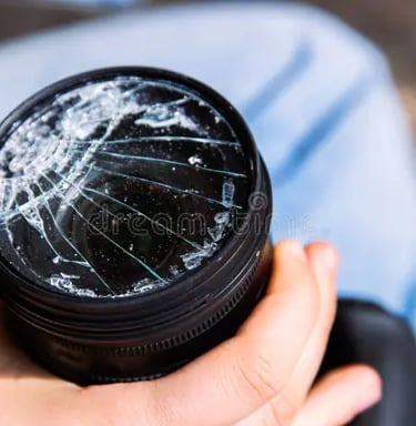 dropped lens with impact damage