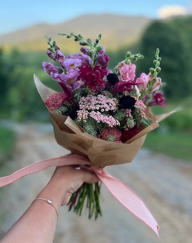 Handheld bouquet of delicate flowers
