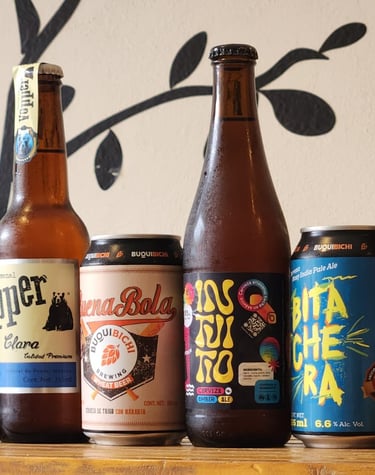 a bunch of beer bottles sitting on a table