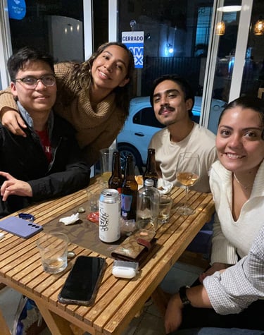 a group of people sitting at a table with drinks