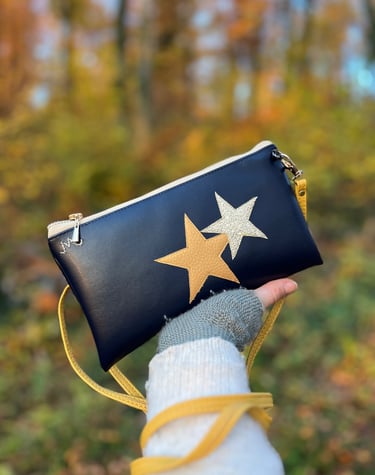Handmade navy Cactus leather clutch bag with gold star accents