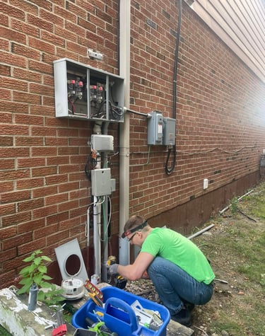 Licensed electricians at XBOCT (XB) Electric installing solar system for net metering