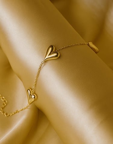 a gold bracelet bracelet bracelet bracelets with a heart shaped leaf