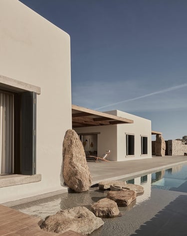 a large rock in front of a house