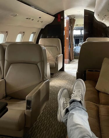 a person's feet on a plane
