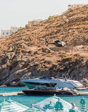 a helicopter helicopter hovers over a boat in the water