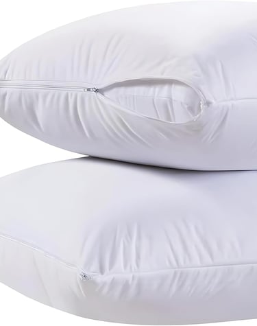 Two white zippered pillow protectors stacked on a white background for allergy and bed bug protection.