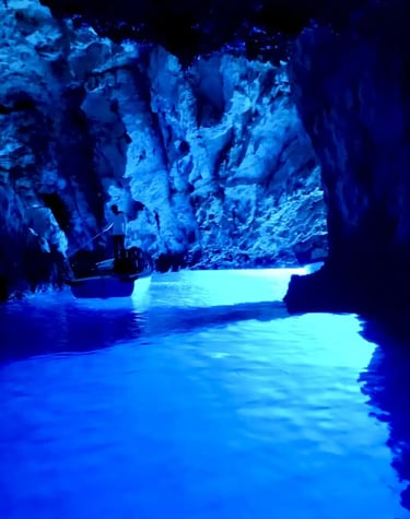 Interior view of the Blue Cave on Bisevo Island, Croatia, showcasing the vibrant glowing blue waters
