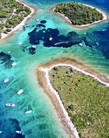 Aerial panoramic view of Blue Lagoon at Drvenik Veliki Island, seen on a private boat tour off the coast of Split, Croatia.