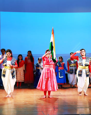 Young students performing a graceful kathak dance on stage at Rabindratirtha auditorium