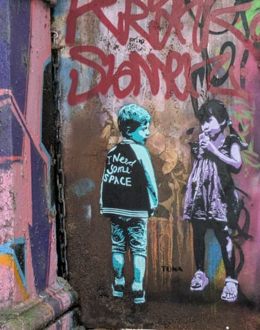 Street art at Rote Flora Hamburg with children stencil graffiti, urbane Kunst und Graffiti Szene in St. Pauli