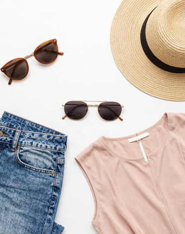 Close-up of elegant accessories and makeup products arranged artistically.