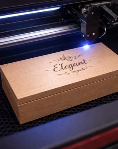 A precision laser engraving machine etching a custom design onto a wooden gift box.