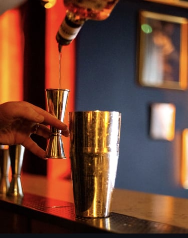 bartender crafting cocktail at stolen moon speakeasy paris