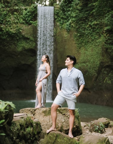 Intimate prewedding couple on rocks at Tibumana Waterfall Bangli Bali