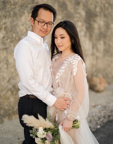 Luxury prewedding couple portrait by limestone cliff at Melasti Beach Ungasan Bali