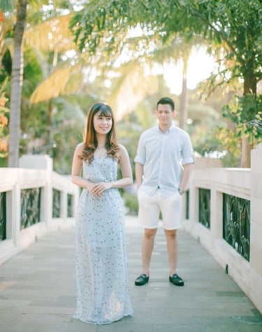 Full body intimate couple portrait on bridge at Sofitel Bali Nusa Dua Beach Resort.