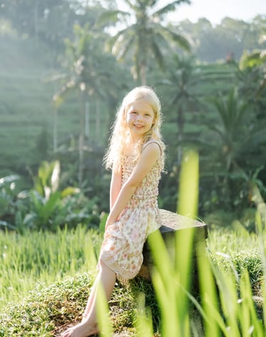 Child portrait in the rice fields during a scenic family photography session in Tegalalang Bali