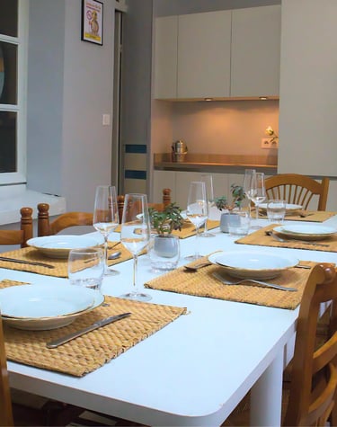 Dining room with equipped table for team meals in professional accommodation