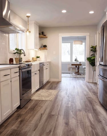 a beautiful kitchen with Luxury Vinyl plank flooring installed by Next Floor LLC in Katy