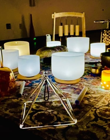 glowing sound bath setup with instruments