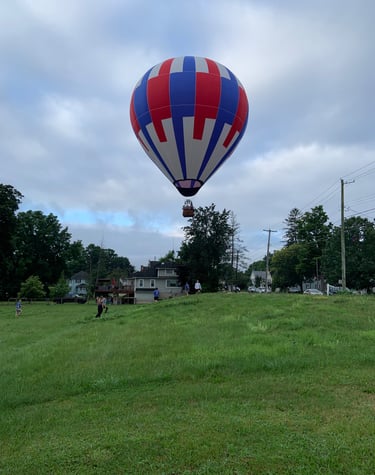 a hot air balloon in a field in Binghamton New York