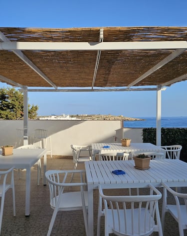 a table with chairs and a table with a bowl of food