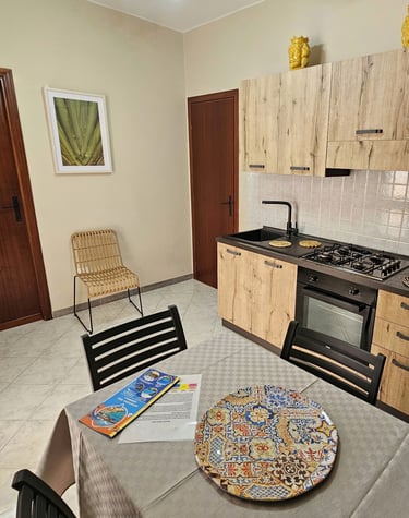 a kitchen with a table and chairs and a table