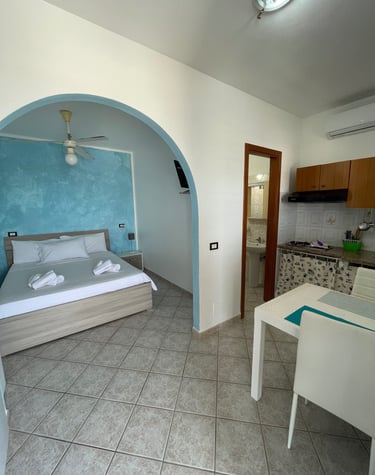 a bedroom with a bed and a table