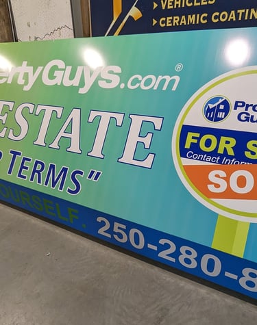 a real estate agent sign board for real estate sale