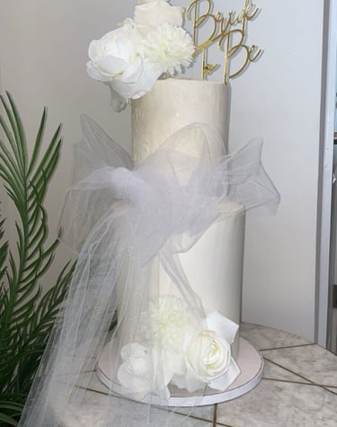a cake with a white cake topperf and a cake topperf